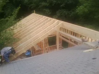 Framing a new roof addition that ties into an existing shingle roof in Garrison