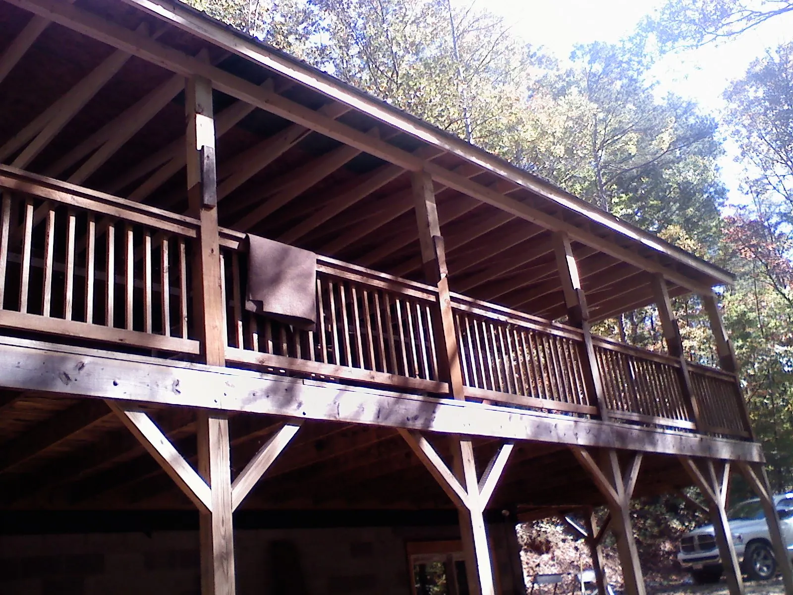 Timber framing under a new elevated porch and deck — Roof Leak Repair in Garrison by Roofing Brothers